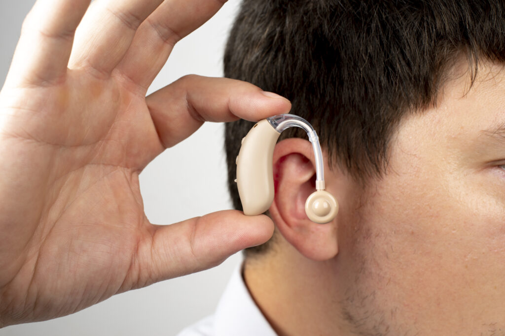 side-view-man-wearing-hearing-aids